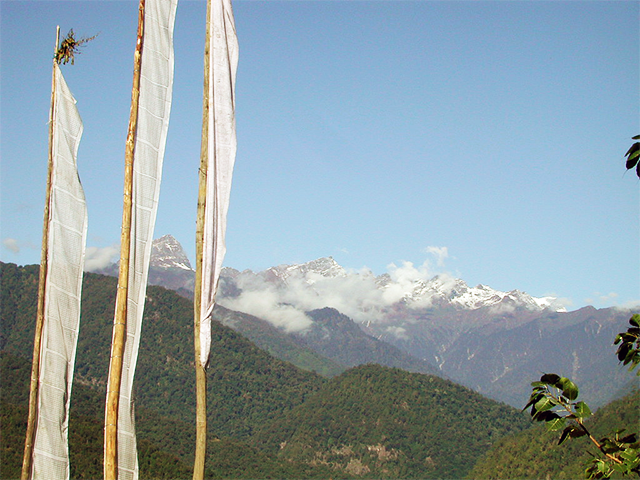 Prayer Flag and Himalayas Photo by Simon Thompson